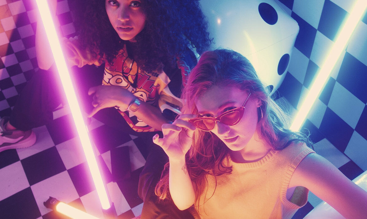 urban girls between bars of colored light